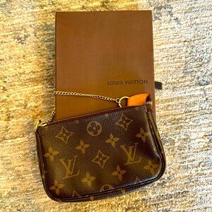 Louis Vuitton Mini Pochette on a chain